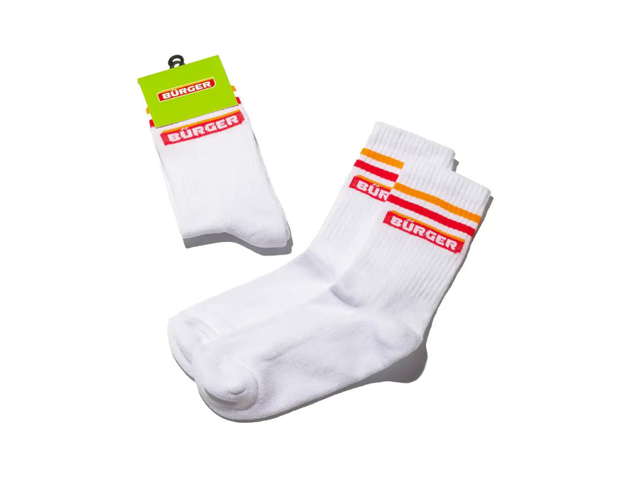 Neongrüne Badeschlappen mit rotem „BÜRGER“-Schriftzug auf dem breiten Fußriemen.