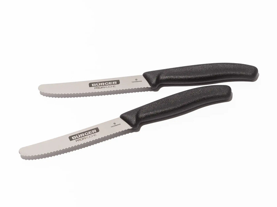 Zwei Wellenschliff-Messer mit schwarzem Griff und BÜRGER-Logo auf weißem Hintergrund.