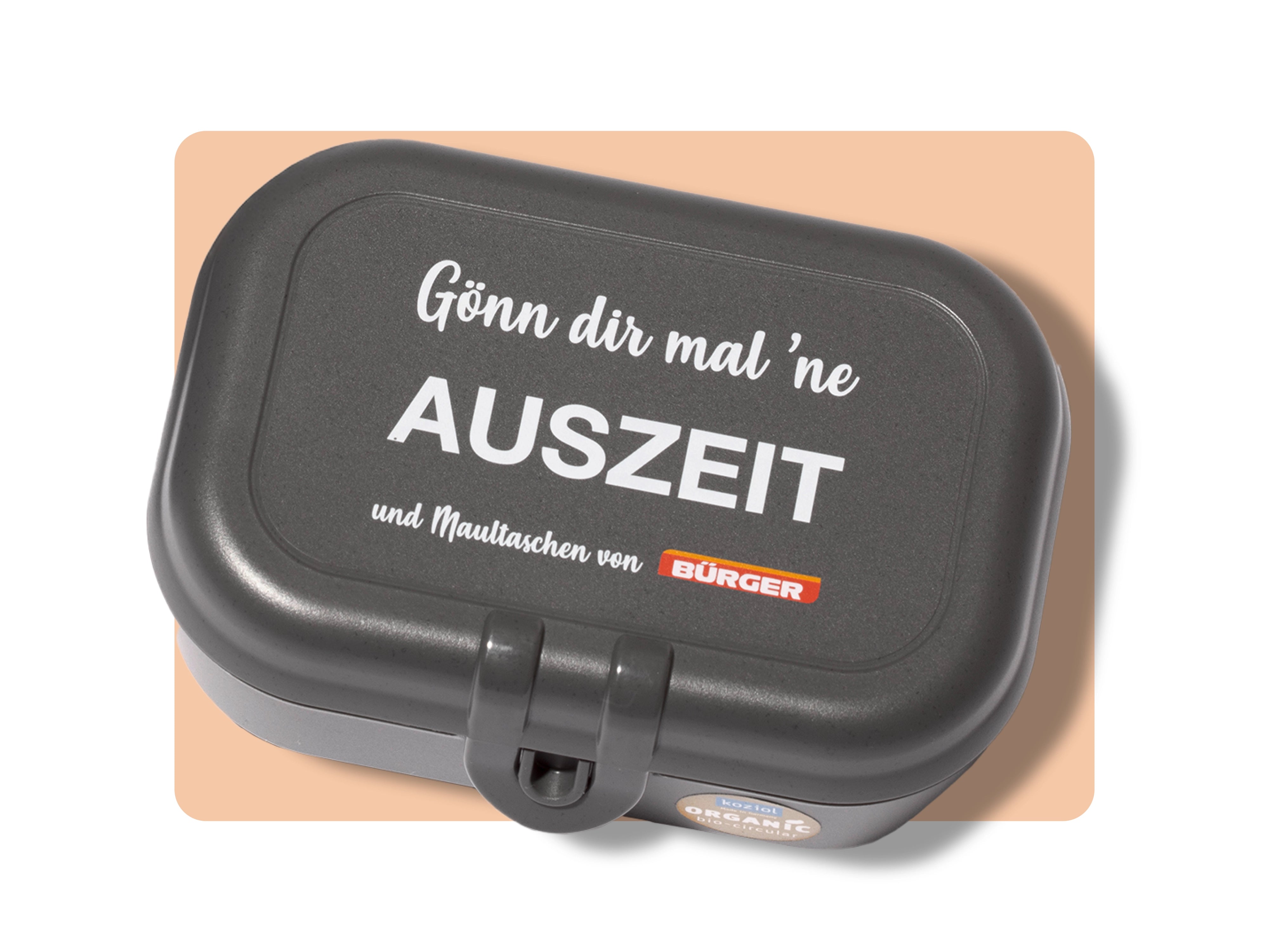 Schwarze Brotdose mit Aufdruck „Gönn dir mal ’ne AUSZEIT“ und „BÜRGER“-Logo darunter