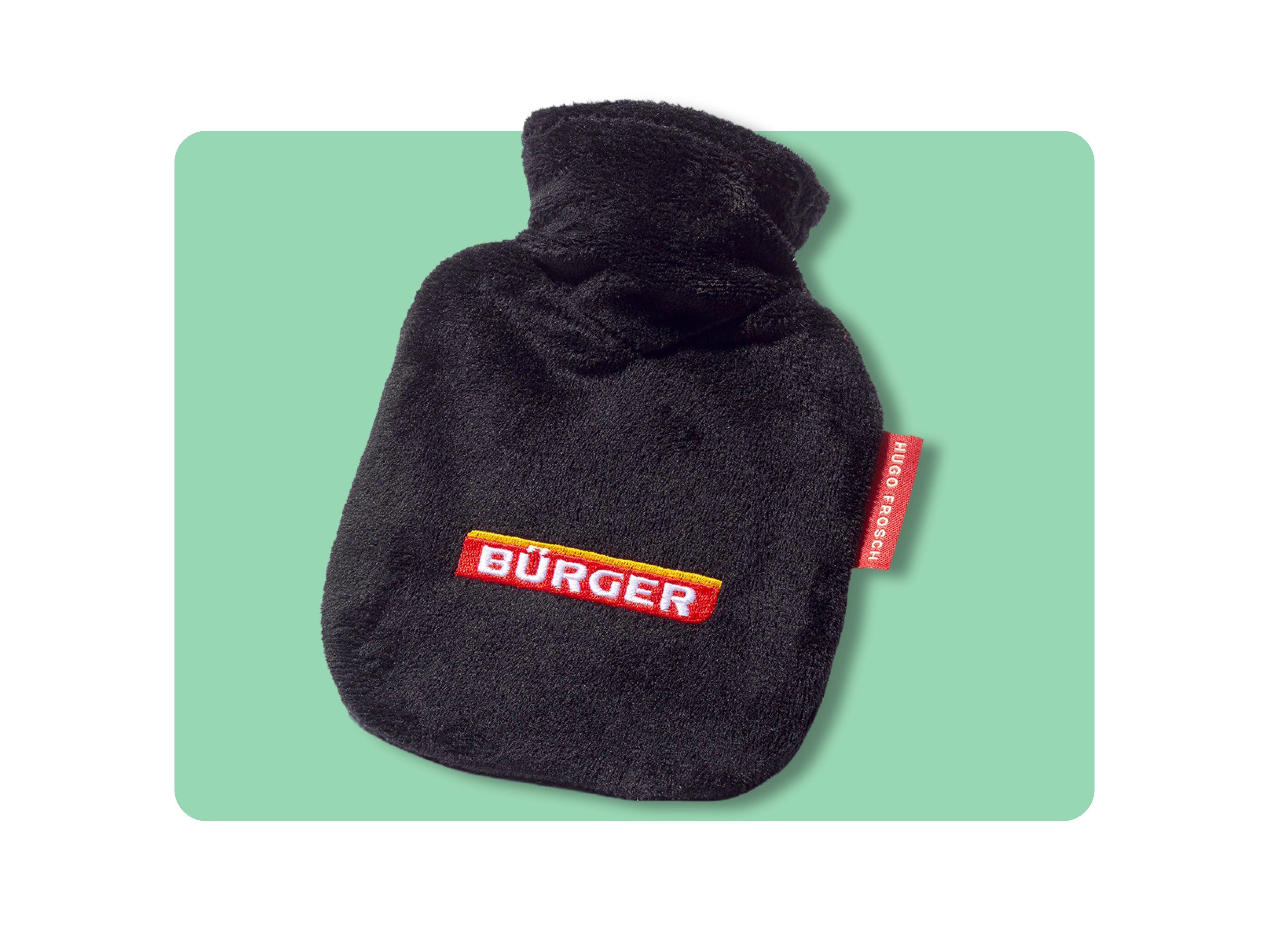 Schwarze Wärmflasche mit rotem „BÜRGER“-Logo und rotem Etikett „HUGO FROSCH“